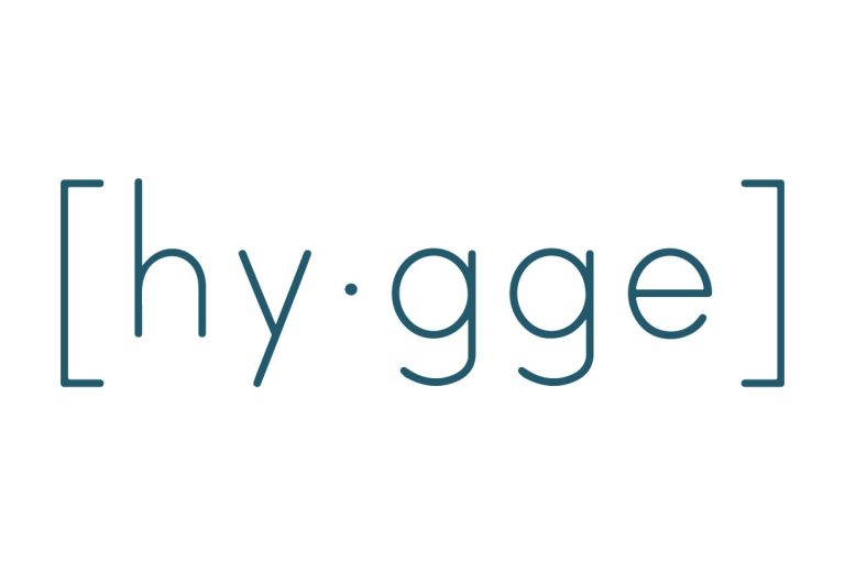 Logo van "UNA MÁS" met de tekst "De wereld in jouw glas."